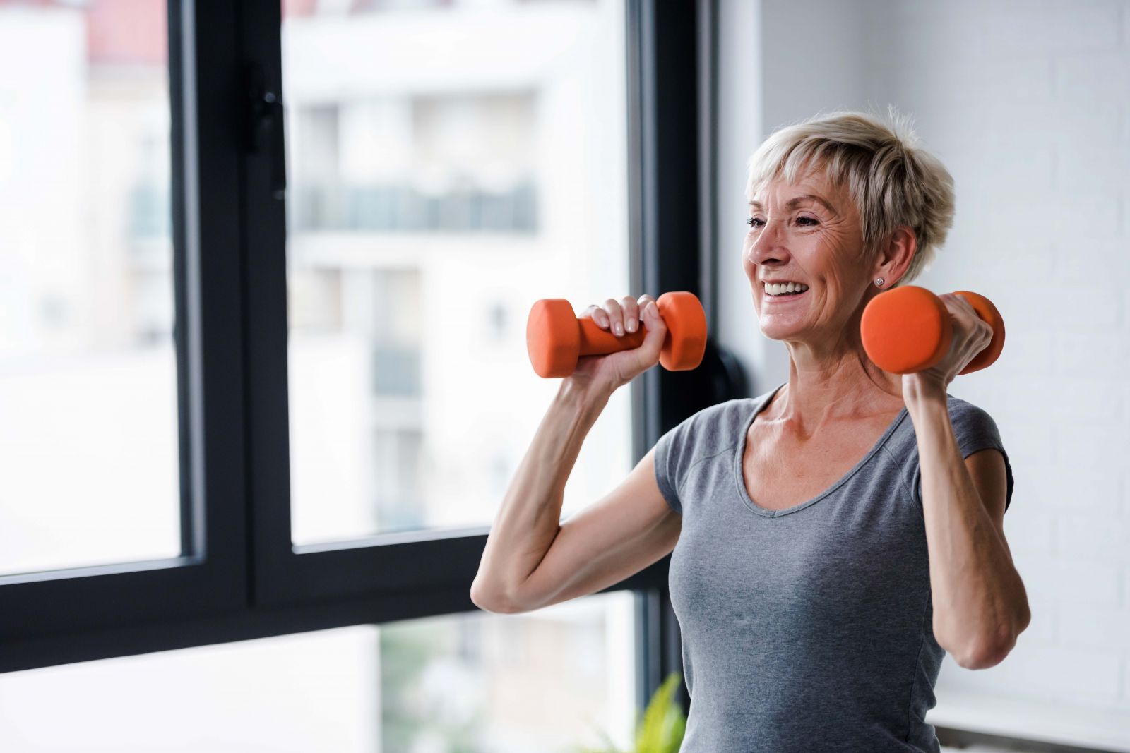 woman working out with hand weights
