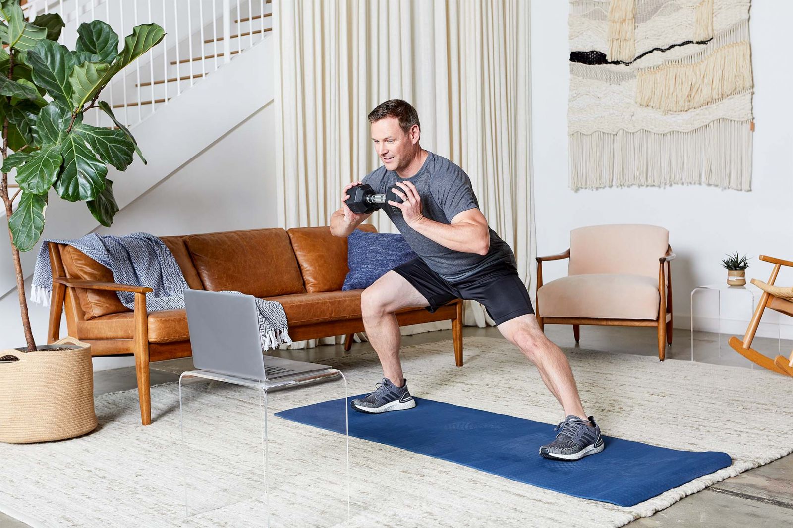 man doing virtual training in living room